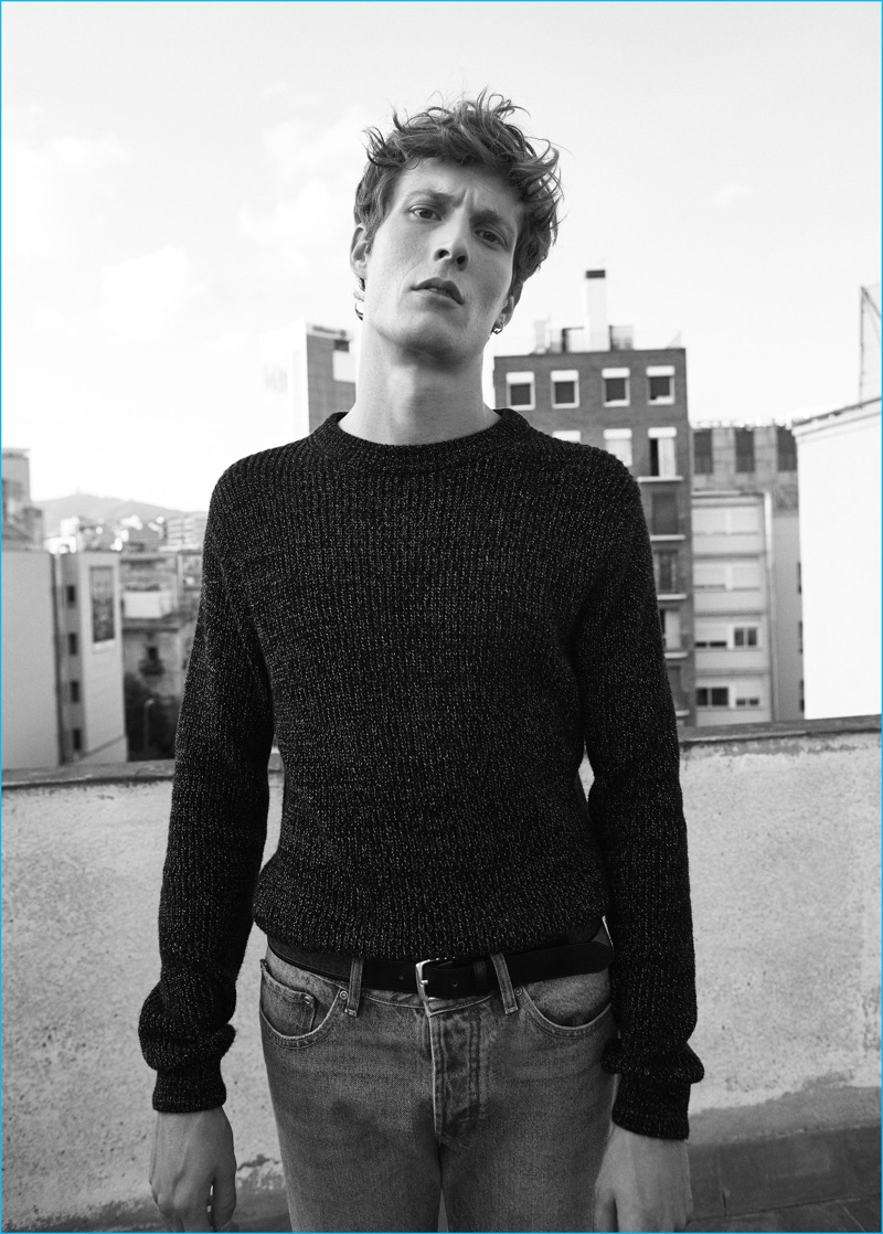 Felix Gesnouin wears a flecked cotton blend sweater with jeans from Mango Man.