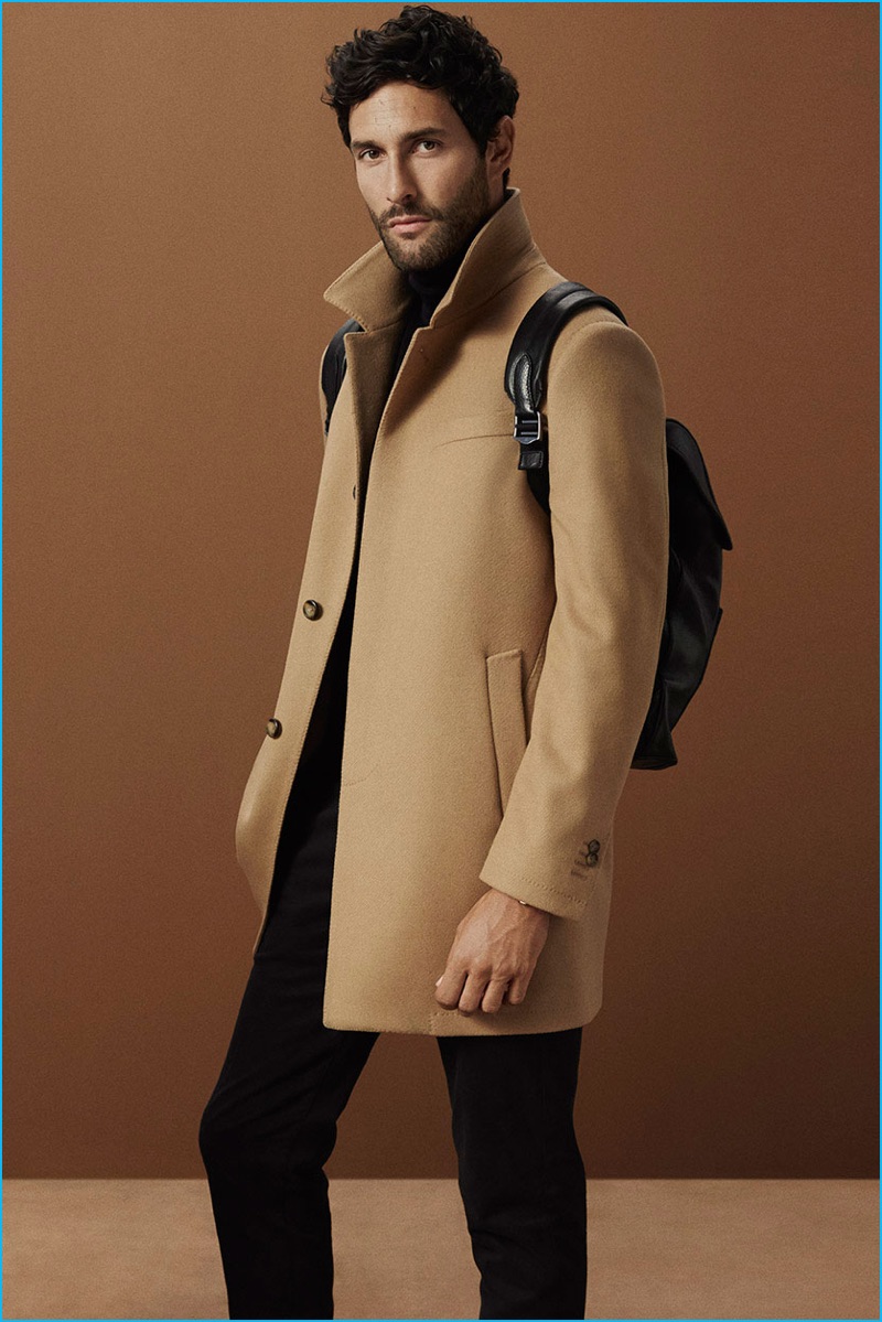 Noah Mills pictured in a single-breasted camel coat from Massimo Dutti.