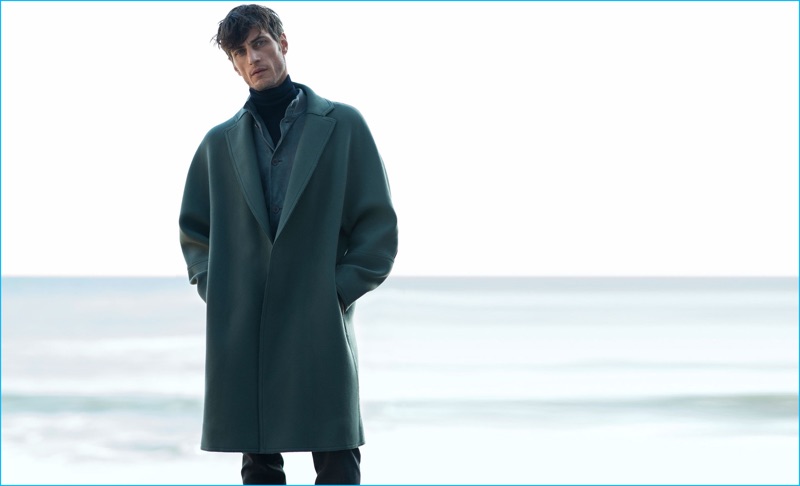 Axel Hermann wears coat Wooyoungmi, suede bomber jacket Tomas Maier, turtleneck and slim-fit flannel trousers Bottega Veneta.