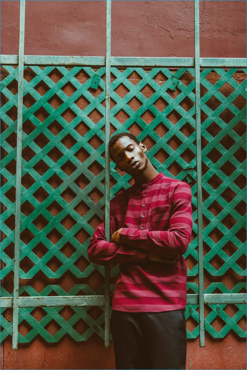 Adonis Bosso wears a red henley from Matiere's fall-winter 2016 collection.