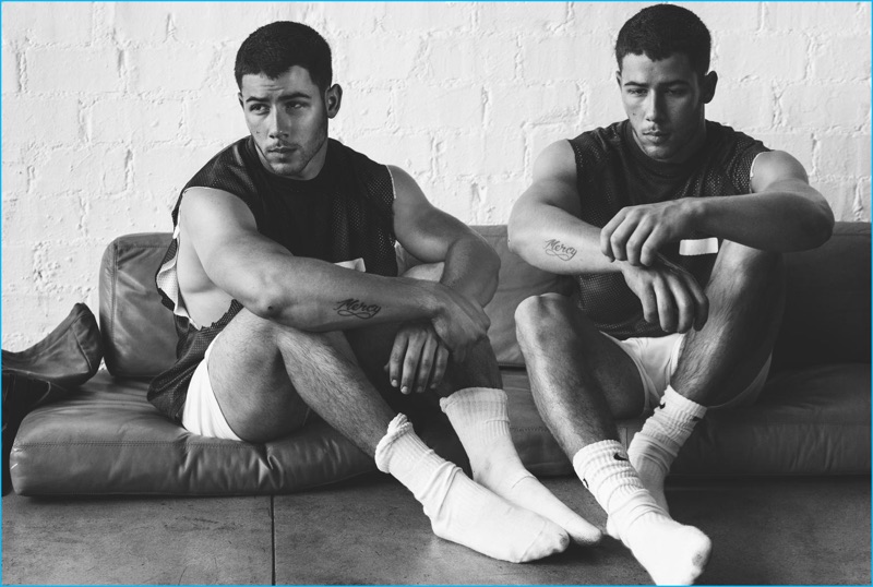 Nick Jonas poses in socks and a muscle tank for his Wonderland photo shoot.