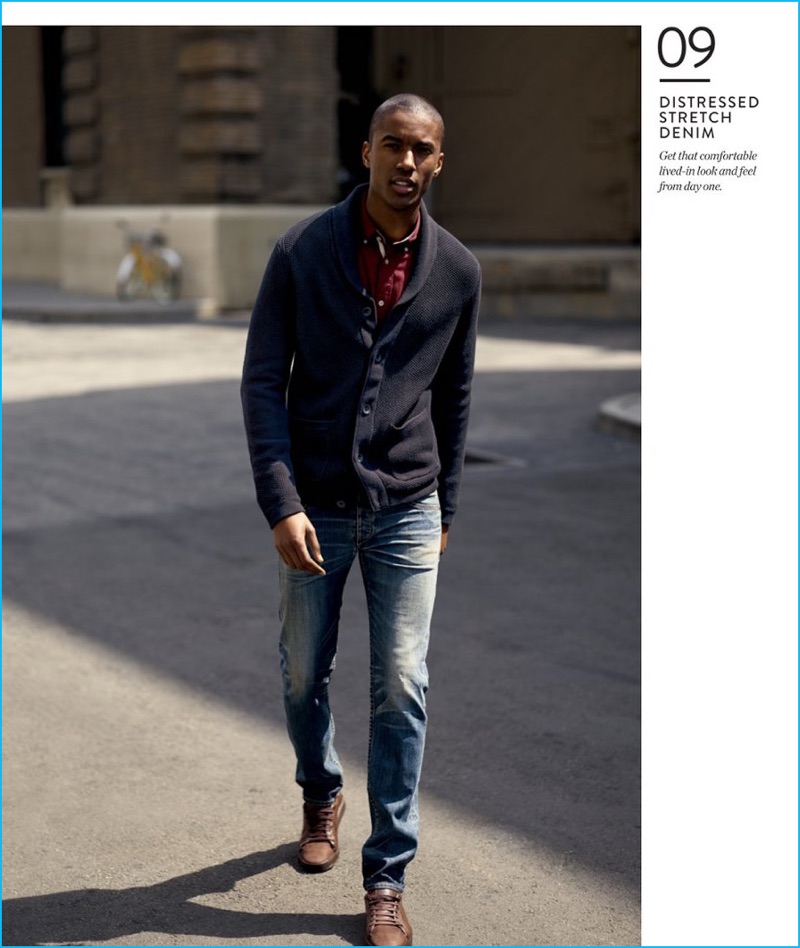 Distressed Stretch Denim: Claudio Monteiro dons Rag & Bone Standard Issue Fit 2 slouchy fit denim jeans with a sport shirt and shawl neck cardigan sweater.