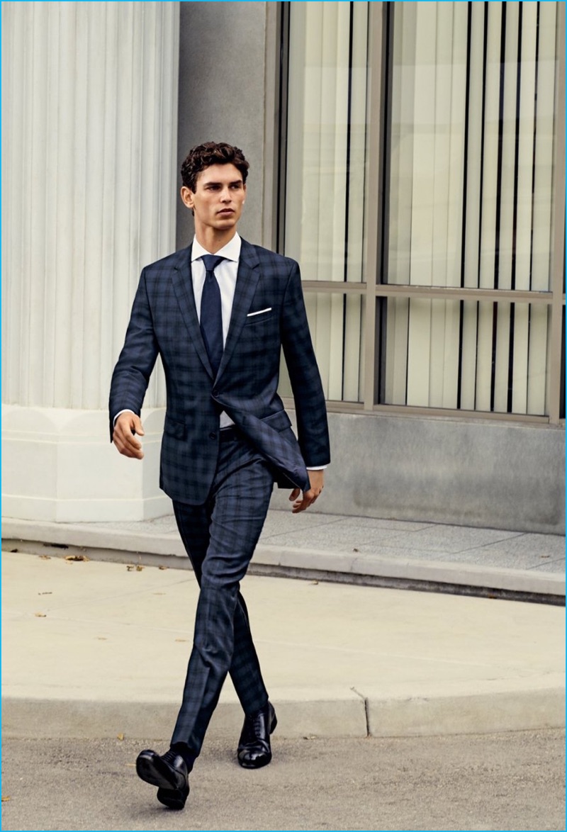 Arthur Gosse wears derby shoes To Boot New York, shirt, tie, and plaid suit BOSS Hugo Boss.