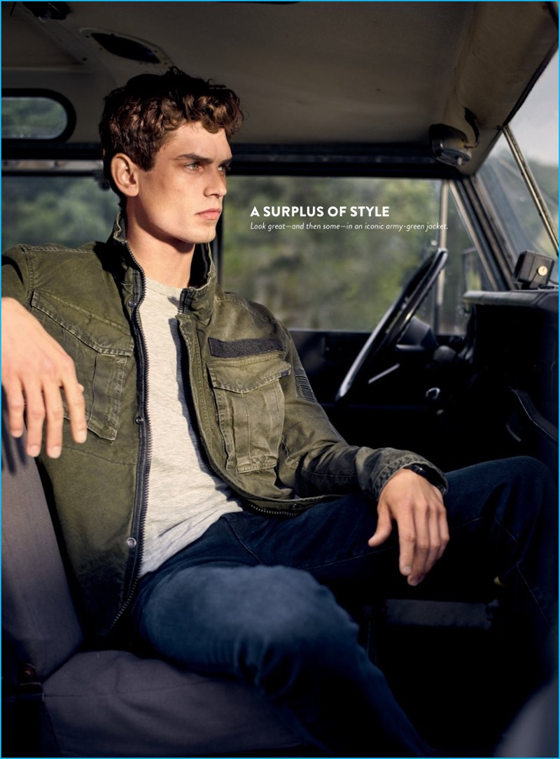 Arthur Gosse wears military style jacket G-Star Raw and denim jeans 7 For All Mankind.