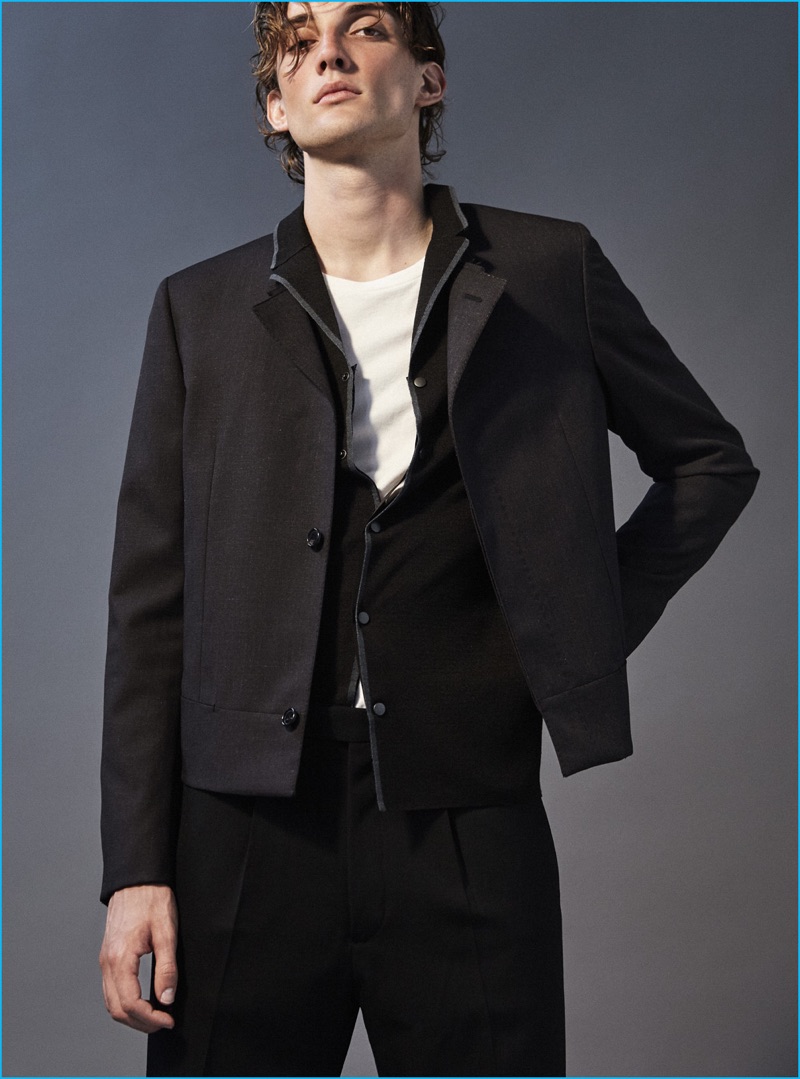 JJ wears collarless suit jacket, knitted shirt jacket, and wide leg trousers Lanvin.