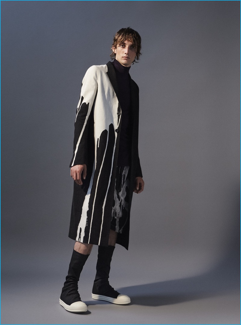 JJ wears stretch sneakers, bleached stain shorts and coat Rick Owens.