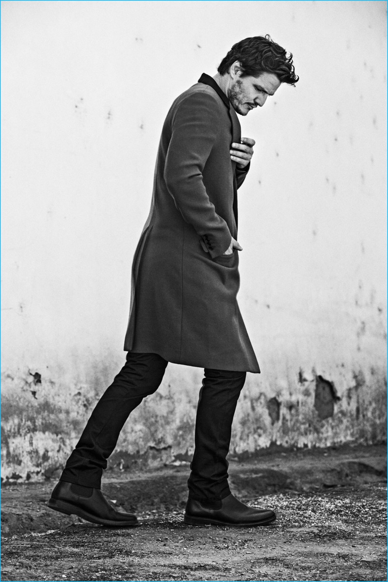 Pedro Pascal pictured in a Lanvin coat with A.P.C. trousers and boots for So It Goes magazine.