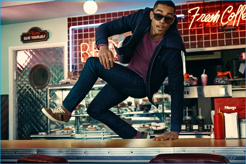 Model Shayne Cureton charms as he hops the diner counter for Original Penguin's fall-winter 2016 campaign.