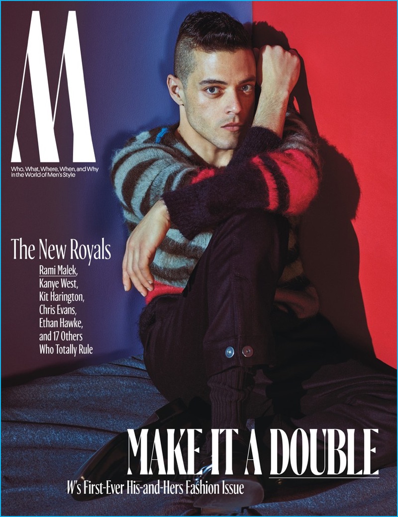 Rami Malek covers W magazine in a colorful striped No.21 sweater with Prada trousers and shoes.