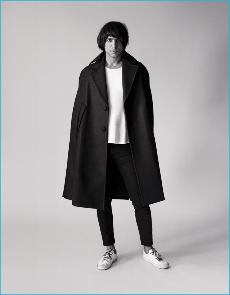 Photographer Sebastian Faena dons an oversized coat for a self-portrait.