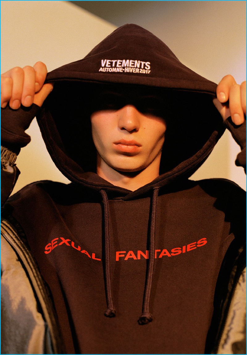 The oversized trend is explored with a Vetements slogan hoodie, paired with a J.W. Anderson padded jacket.