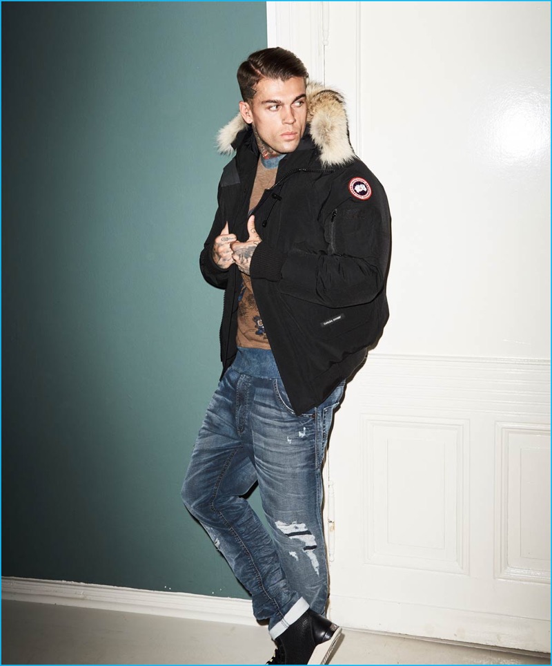 Stephen James goes casual in a Canada Goose jacket with distressed denim jeans and a graphic sweatshirt from Diesel for Theo Wormland's fall-winter 2016 campaign.