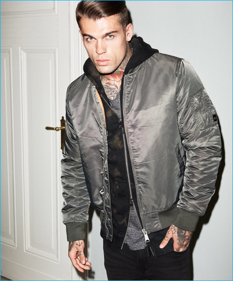 Stephen James is picture-perfect in a Vintage Industries army green bomber jacket with a Tigha t-shirt, Diesel sweatshirt, and Cheap Monday denim jeans for Theo Wormland's fall-winter 2016 campaign.