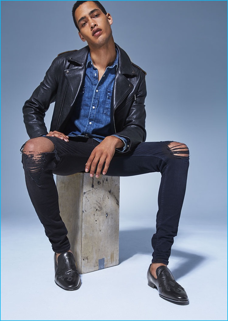 Western Cool: Steve Madden juxtaposes a trendy leather biker jacket and jeans look with a western style denim shirt and its black leather Notate loafers.