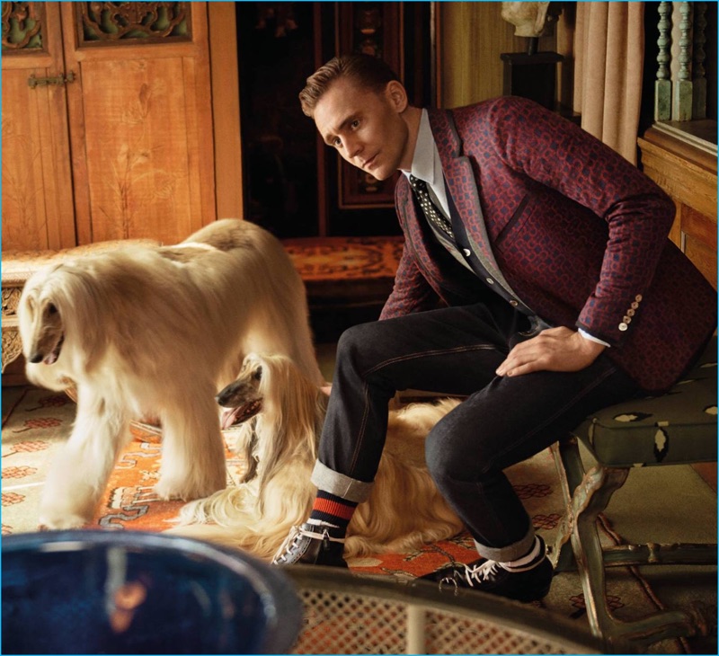 Tom Hiddleston pictured in a jacquard jersey jacket with denim jeans, web socks and Dionysus boots for Gucci's cruise 2017 tailoring campaign.