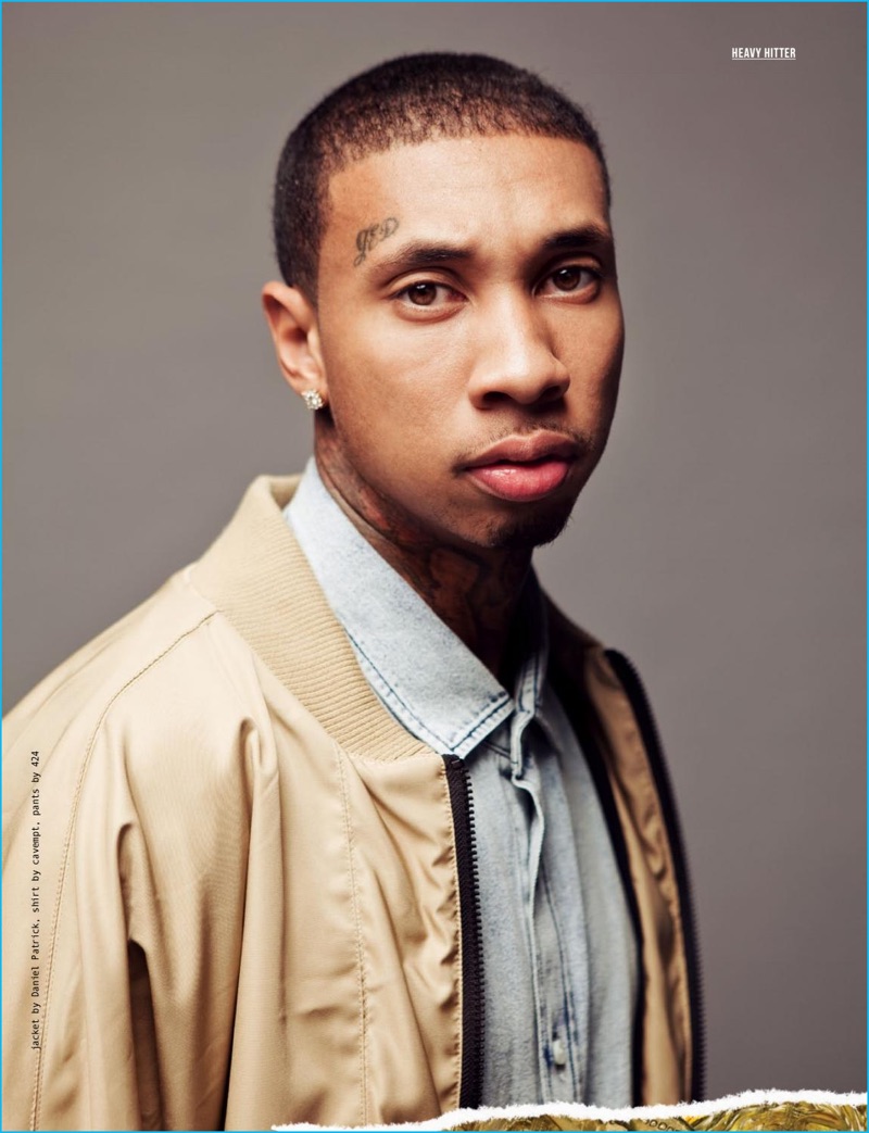 Tyga poses for the pages of Status magazine in a Daniel Patrick tan bomber jacket with a Cavempt shirt.