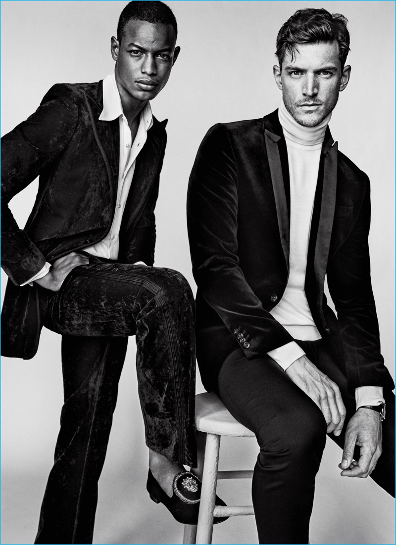 Left to Right: Conrad Bromfield wears suit Bottega Veneta, shirt Jeffrey Rüdes, and shoes Giuseppe Zanotti Design. Logan Macrae wears suit Philipp Plein, turtleneck Versace, and watch Omega.