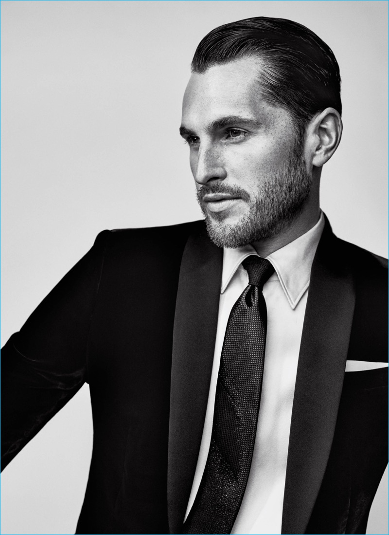 Jake Davies wears jacket Emporio Armani, tie Title of Work, shirt and pocket square Giorgio Armani.