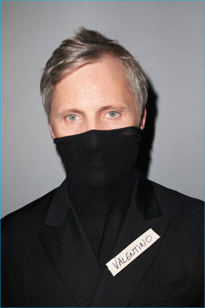 Viggo Mortensen poses for a cheeky photo in Valentino for GQ France.