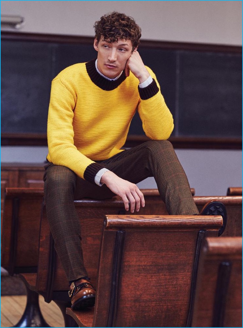 Westley Moore wears yellow sweater Gucci, striped shirt Dior Homme, check trousers Givenchy, and brown leather dress shoes Prada.