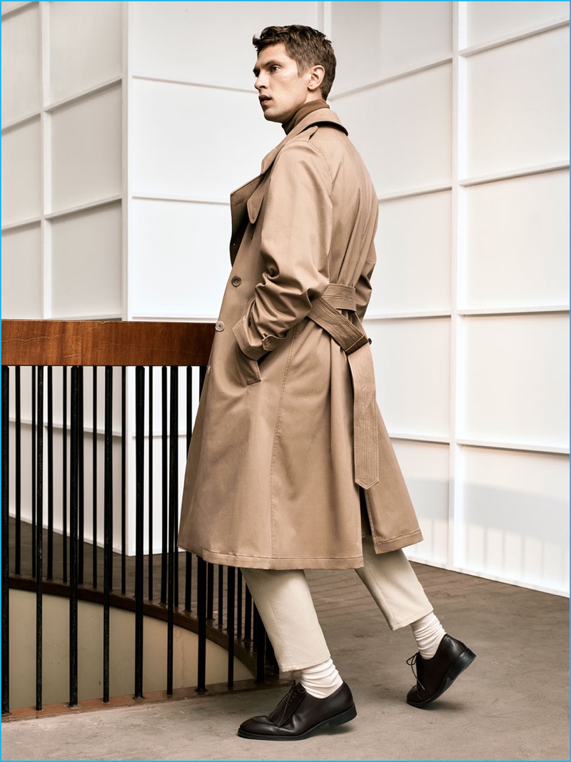 Mathias Lauridsen pictured in a tan trench coat from Zara Man's fall-winter 2016 Studio collection.