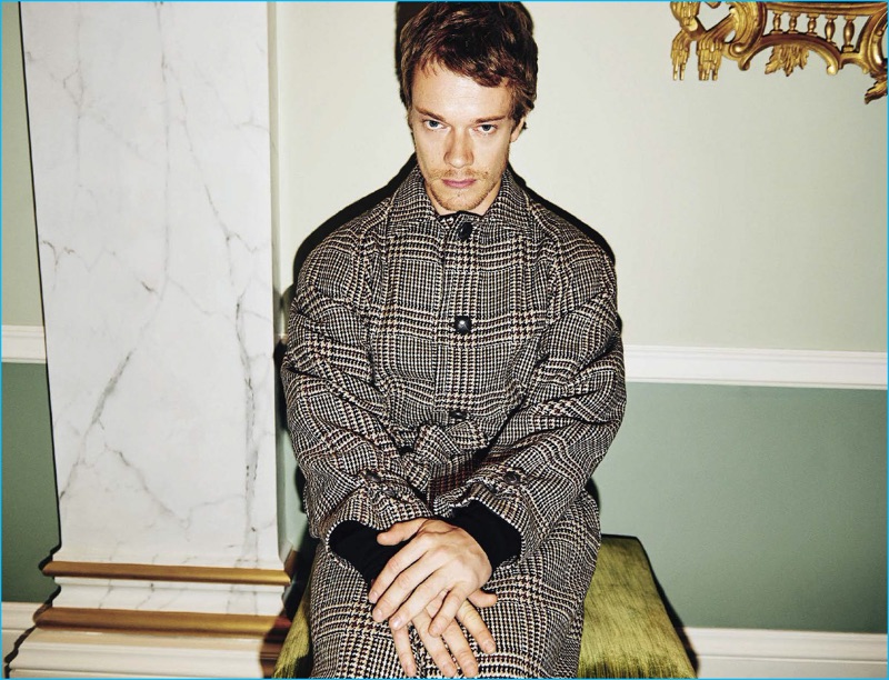 Charming in houndstooth, Alfie Allen wears a look from Boglioli. 