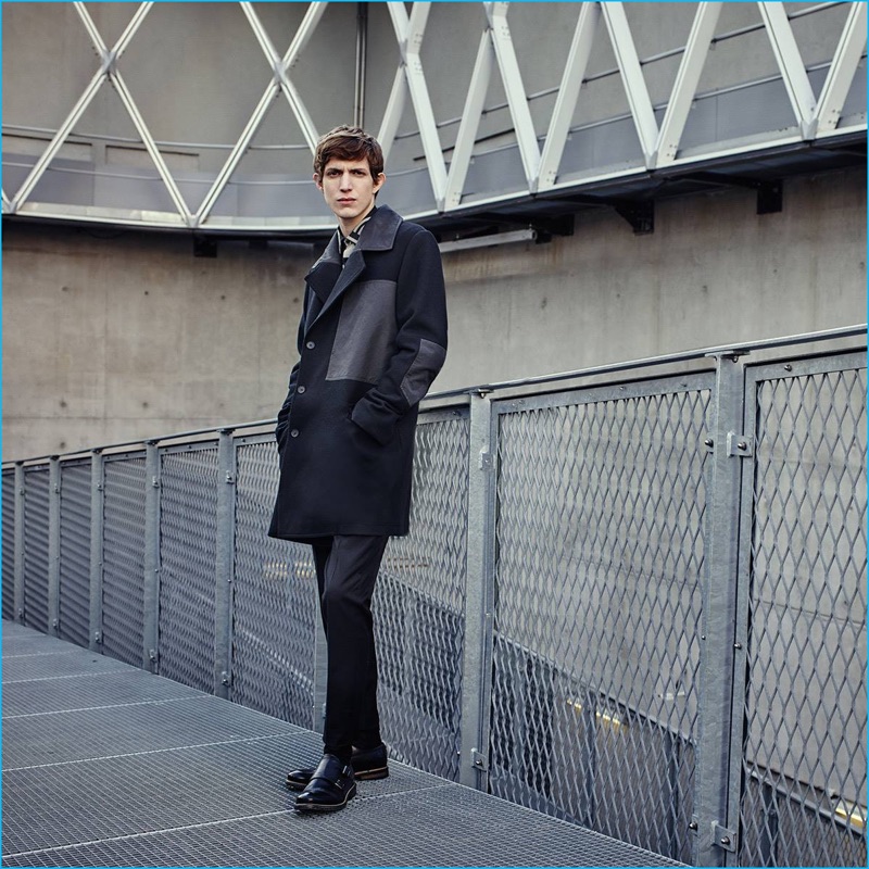 Venturing outdoors, Xavier Buestel wears a long coat and slim trousers for Antony Morato's fall-winter 2016 campaign.