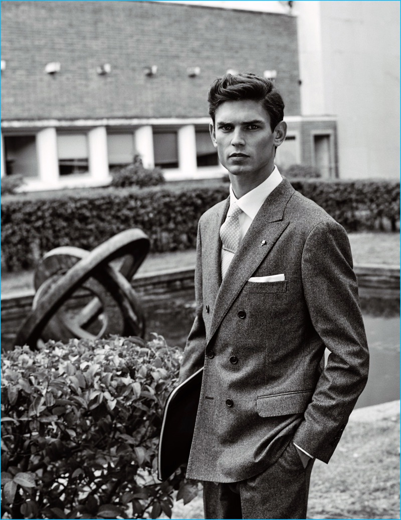 Sergi Pons photographs Arthur Gosse in a Brunello Cucinelli suit. The top model also dons a Hermes tie, Polo Ralph Lauren shirt, Mirto pocket square, and Boss by Hugo Boss portfolio.