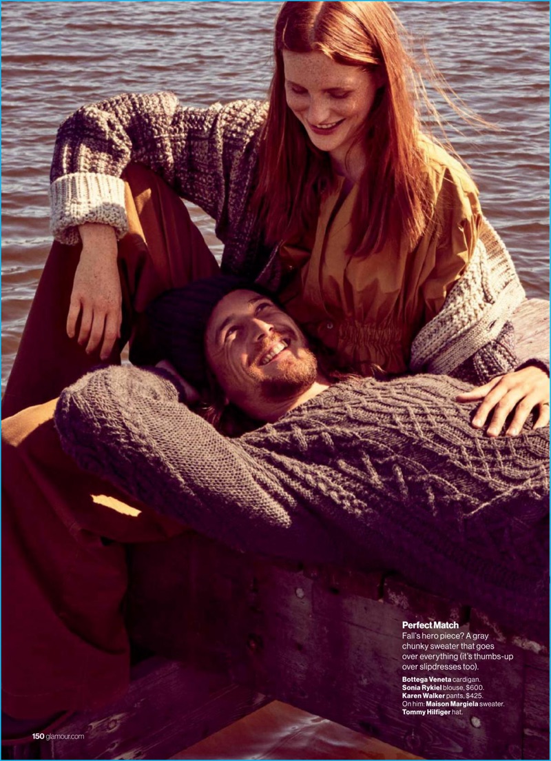 Wearing a Maison Margiela cable-knit sweater with a Tommy Hilfiger knit beanie, Ben Robson charms in a photo with Magdalena Jasek for Glamour.