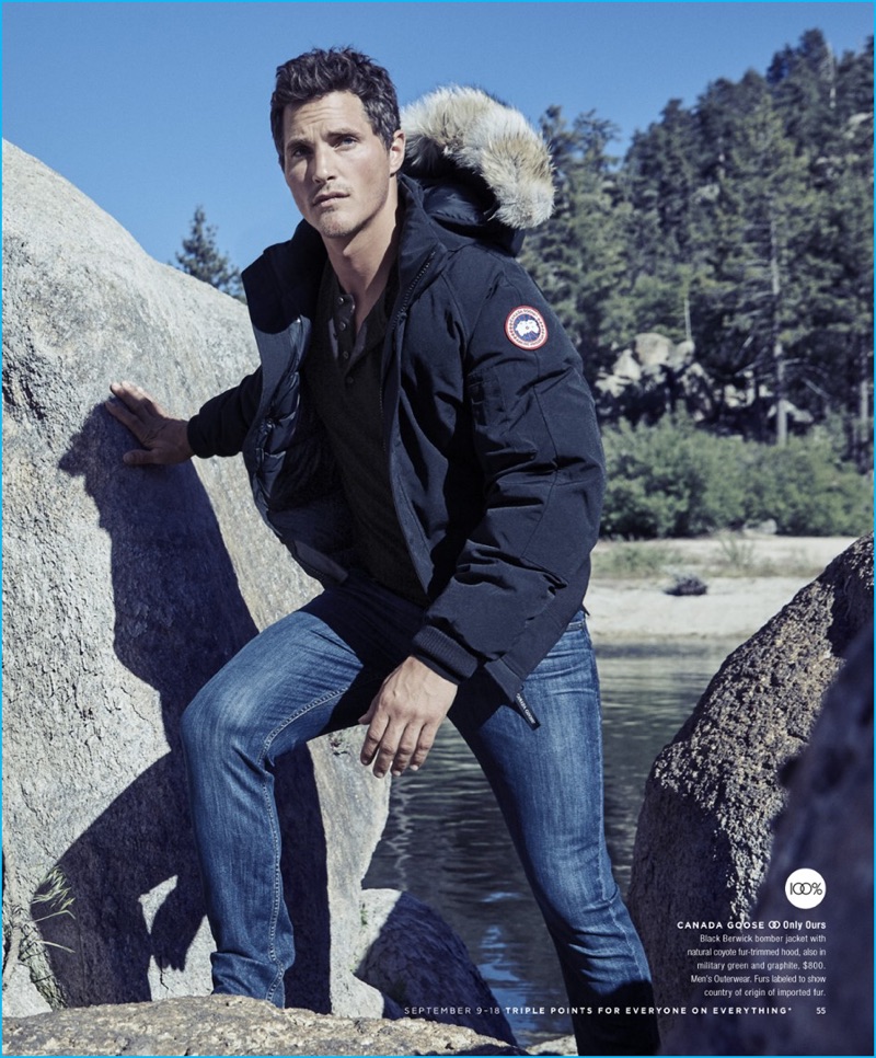 Ollie Edwards sports a black bomber jacket from Canada Goose for Bloomingdale's.