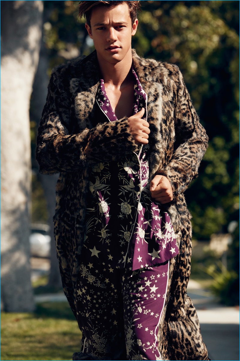 Cameron Dallas heads outdoors wearing a pajama-inspired number and leopard fur coat from Roberto Cavalli.