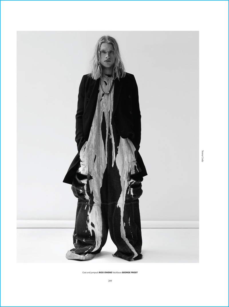 Model Carlton Ruth wears a coat and jumpsuit from Rick Owens with George Frost necklaces.