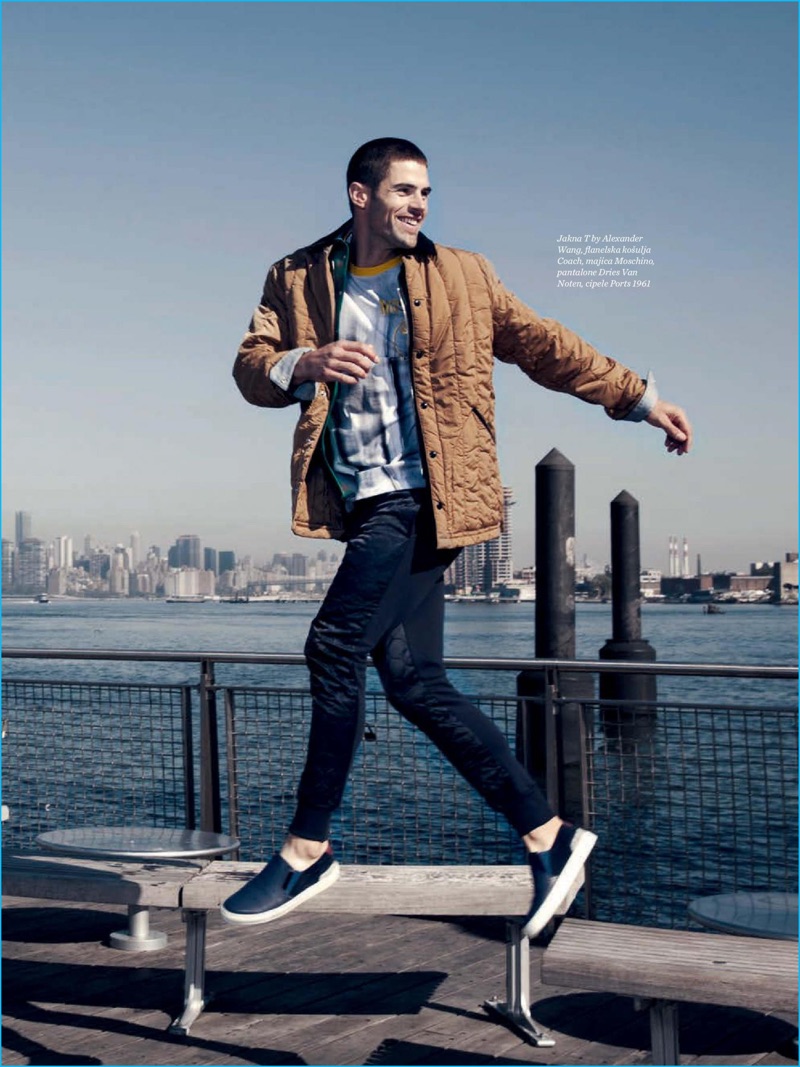 Model Chad White wears a T by Alexander Wang quilted jacket with a Coach flannel shirt, Moschino t-shirt, Dries Van Noten pants, and Ports 1961 sneakers.