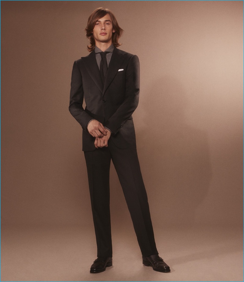 Front and center, Anders Donatelli dons a one-button suit, textured cotton shirt, and leather Venetian slippers from Cifonelli.