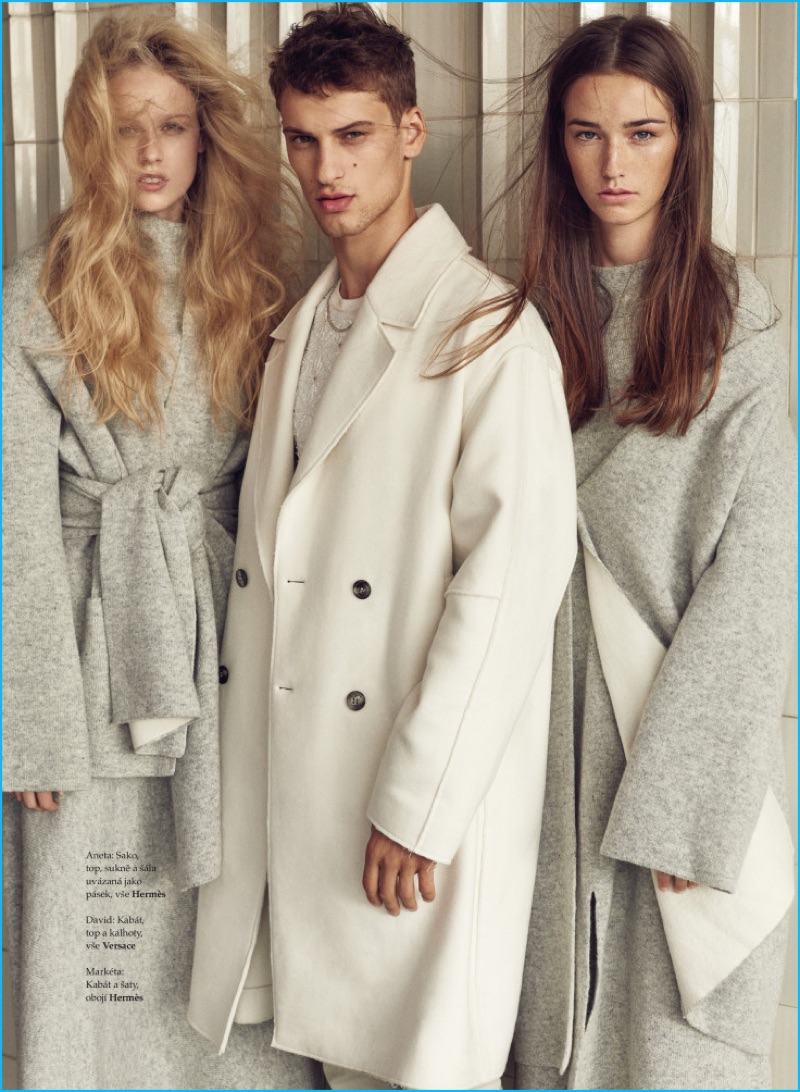 Joined by models Aneta Mestanova and Marketa, David Trulik is front and center in an oversized Versace coat for Elle Czech.