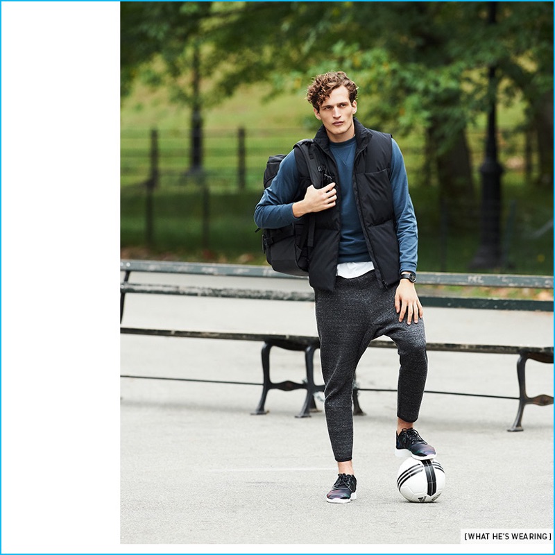 Taking to Central Park, Kimi Halili wears Y-3's stripes tee, classic crewneck sweatshirt, matte down vest, and future sport sweatpants. Kimi also sports a Y-3 ultra backpack and Yohji running shoes with a Braun classic chronograph watch.