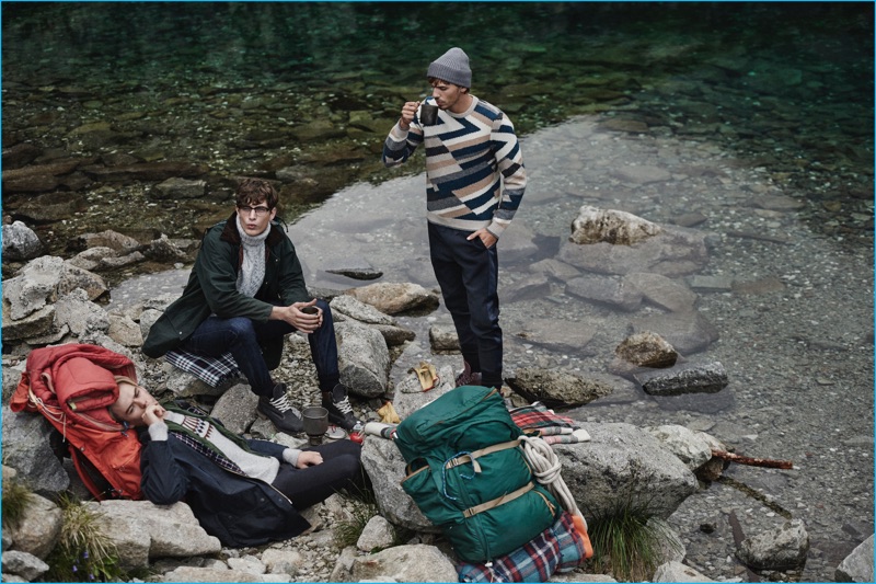 Left to Right: Greg Nawrat relaxes in sweater Marc O'Polo, pants Levi's shirt Timberland, and scarf Calzedonia. Natan Berkowicz models vintage fashions with sweater Ami and pants COS. Adam Kaszewski enjoys a warm beverage, while wearing a Salvatore Ferragamo sweater, CO pants, a Timberland beanie, and Balenciaga boots.