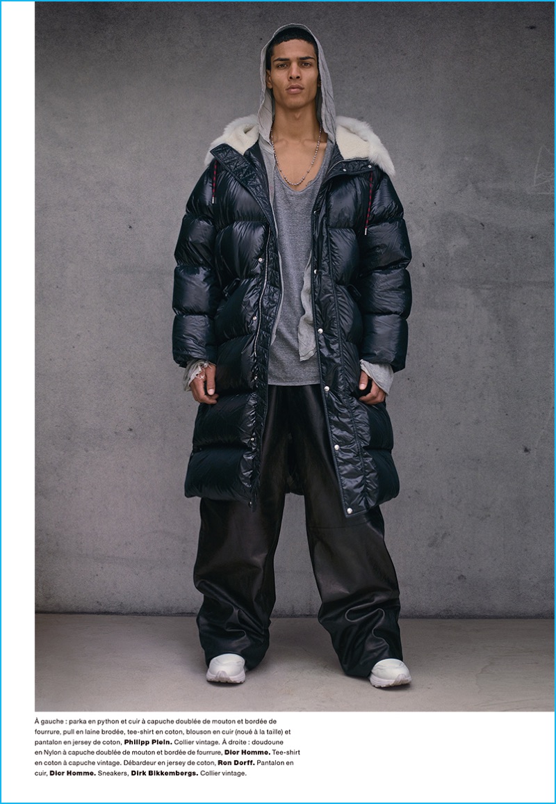 Pumping up the volume, Geron McKinley models a Dior Homme down jacket and pants with a Ron Dorff t-shirt and Dirk Bikkembergs sneakers.