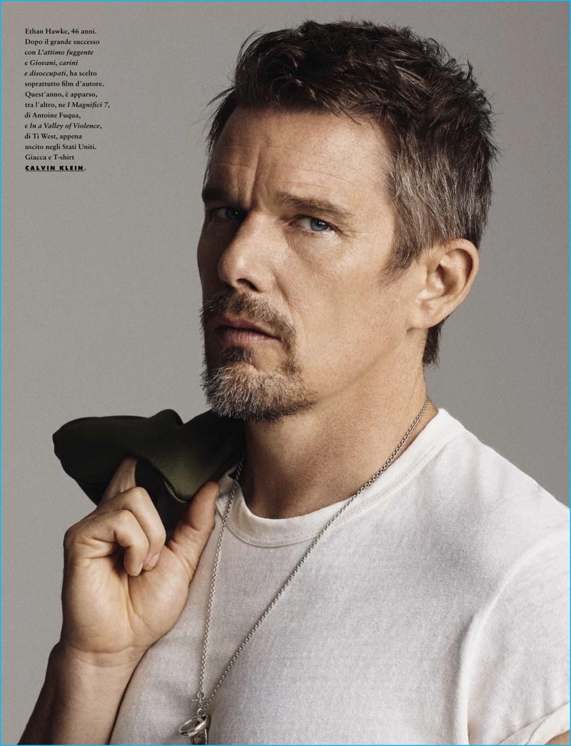 Actor Ethan Hawke sports a t-shirt and jacket from Calvin Klein.