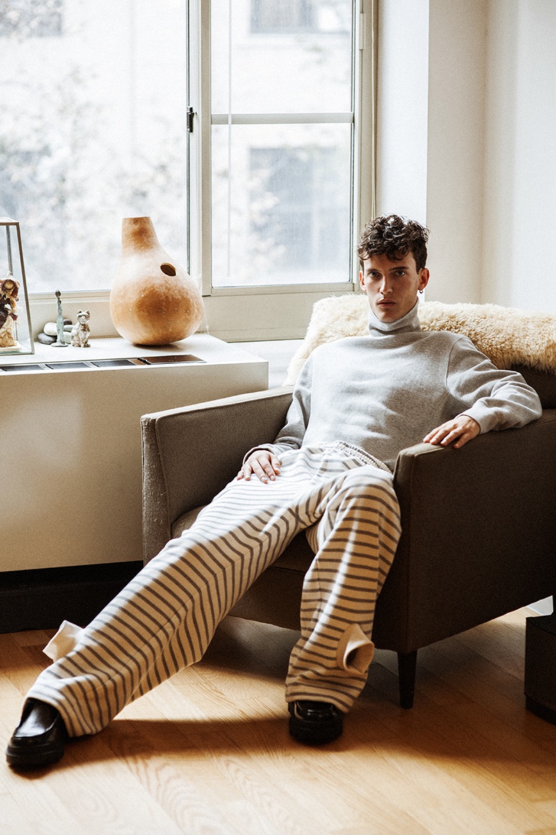 Dzhovani Gospodinov relaxes in a Steven Alan turtleneck with Gosha Rubchinskiy striped sweatpants and Zara shoes.