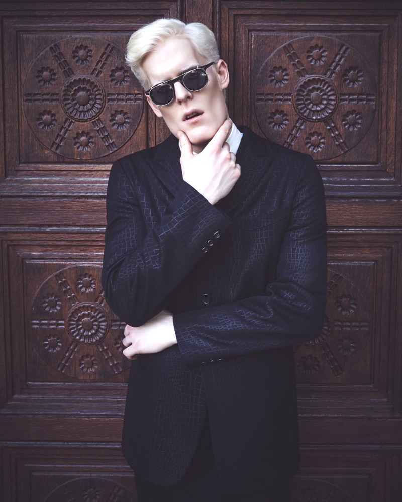 Stephen Thompson dons a Comme des Garçon suit with an Ermenegildo Zegna shirt, Lanvin tie, and Moscot sunglasses.