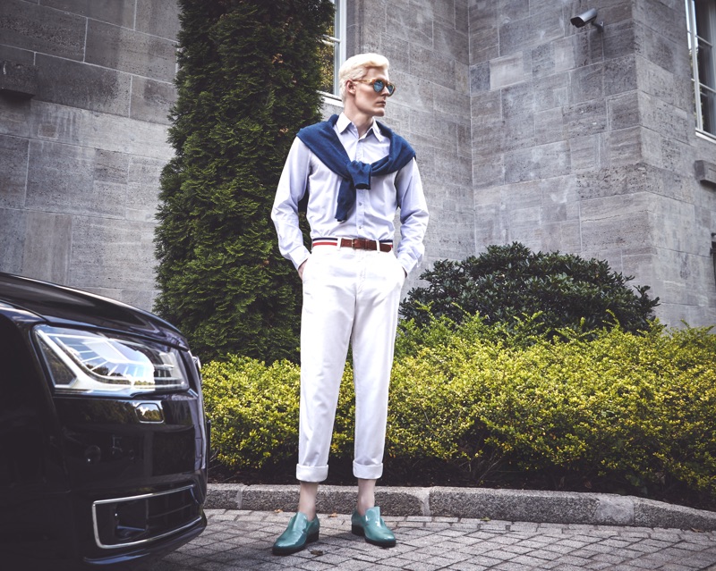Stepping out, Stephen Thompson wears Dolce & Gabbana trousers with a Jil Sander shirt, Maison Margiela sweater, Roger Vivier shoes, an El Ganso belt, and IC Berlin sunglasses.