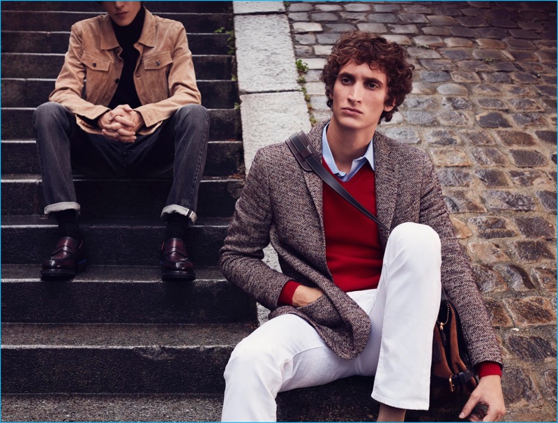 Florent Strambio dons a tweed Spontini jacket with a COS shirt, Jacob Cohen white denim jeans, an Eric Bompard sweater, Colmar shirt, and Coach bag.