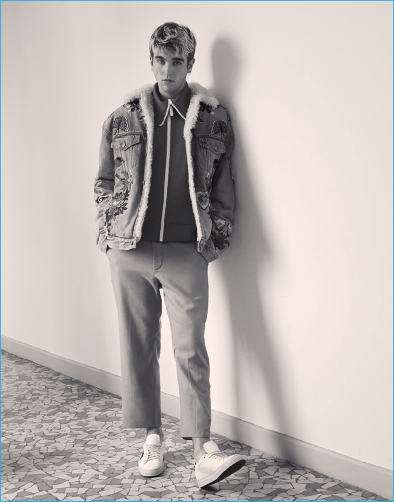 Embracing a nonchalant attitude, Gabriel-Kane Day-Lewis wears a Gucci denim jacket and pants with a Burberry track jacket, and Paul Smith sneakers.