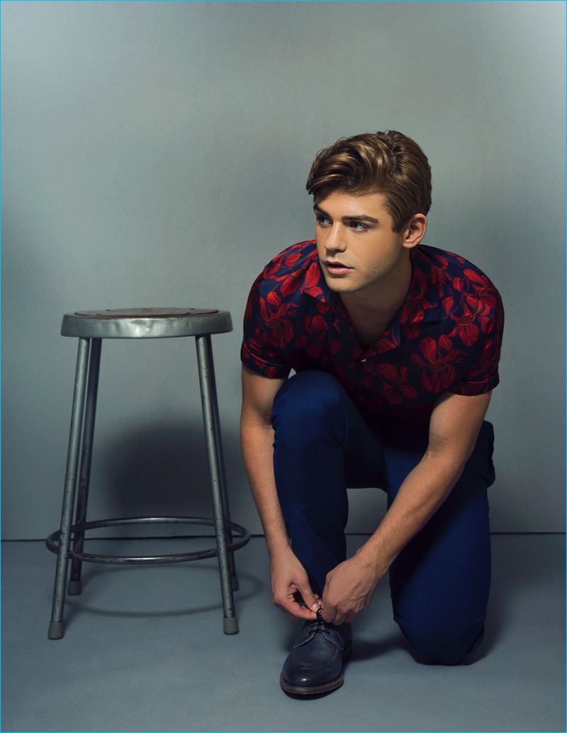 Appearing in a Ferrvor photo shoot, Garrett Clayton sports a shirt and pants from Zara with John Varvatos shoes.