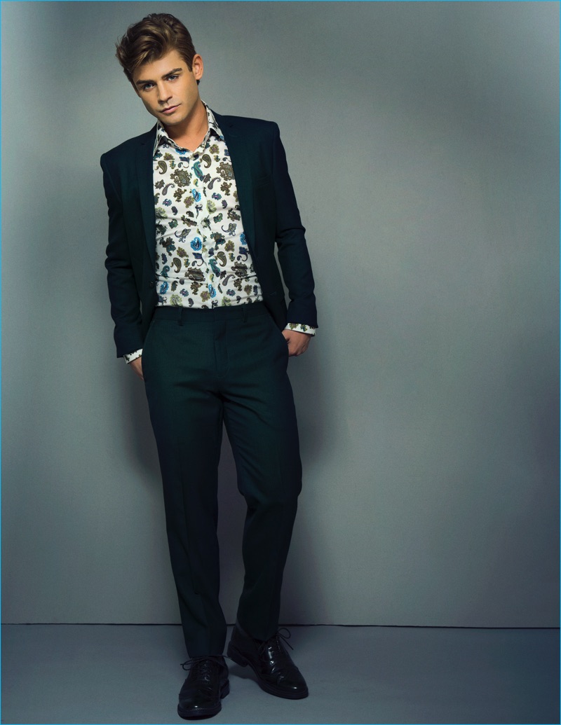 Apuje Kalu outfits Garrett Clayton in a Calvin Klein Collection suit, Kenzo shirt, and Bar III shoes for Ferrvor magazine.