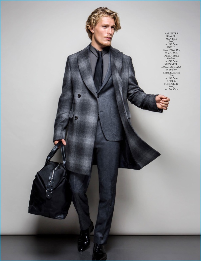 Dashing in a Joop! coat, Harry Goodwins wears a Marc O'Polo suit, Drykorn shirt, s.Oliver Black Label tie, Gant bag, and Joop! shoes.