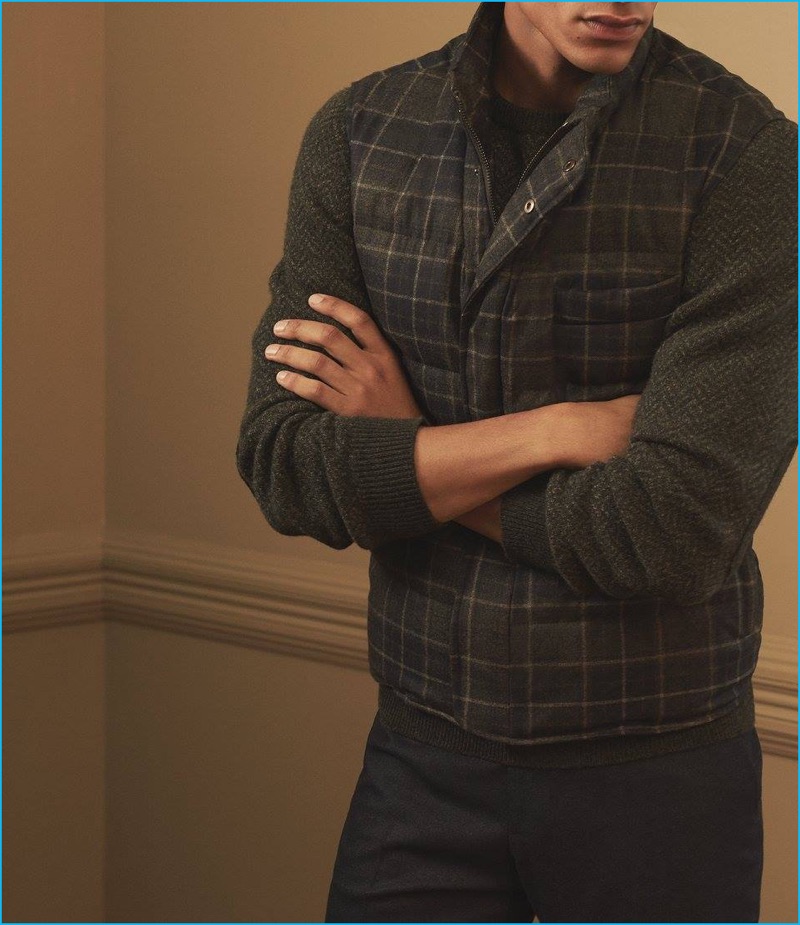 ISAIA offers a smart casual spin on fall with a plaid quilted vest, wool herringbone-weave sweater, and flannel trousers.