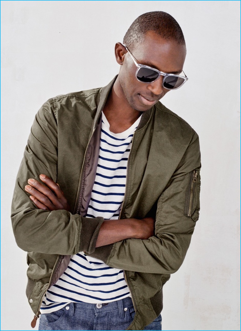 Channeling military style, Armando Cabral wears a green J.Crew bomber jacket.