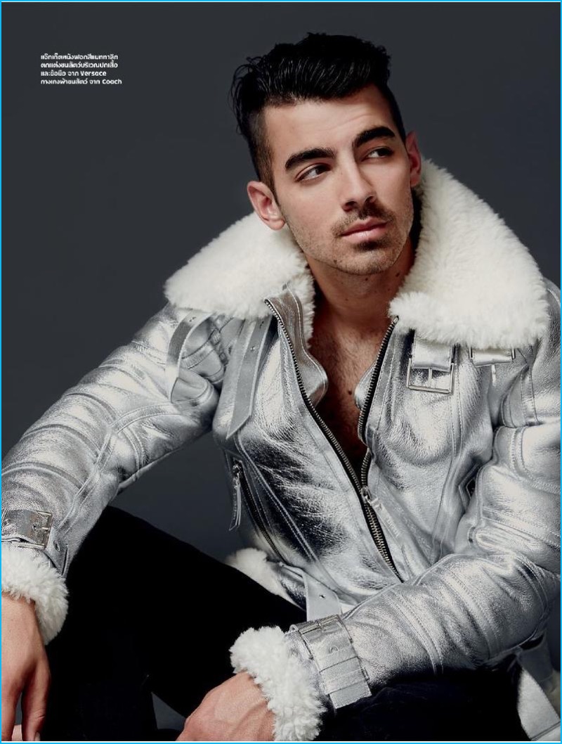 Joe Jonas pictured in a silver jacket from Versace for L'Optimum Thailand.
